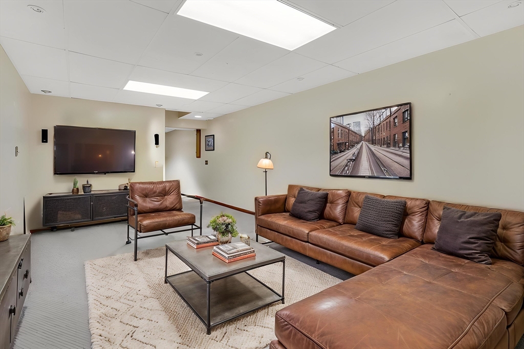 5 Evergreen Circle Wilbraham, MA 01095 - Photo 33 of 39 a living room with furniture and a flat screen tv