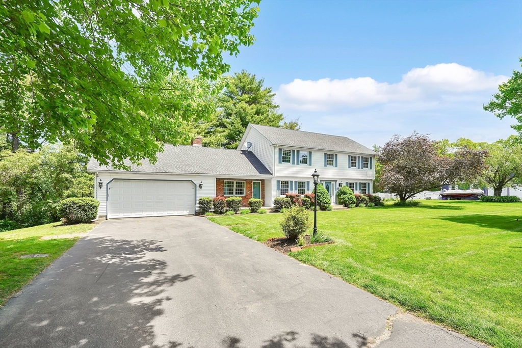 5 Evergreen Circle Wilbraham, MA 01095 - Photo 39 of 39 a front view of a house with a yard and a garage