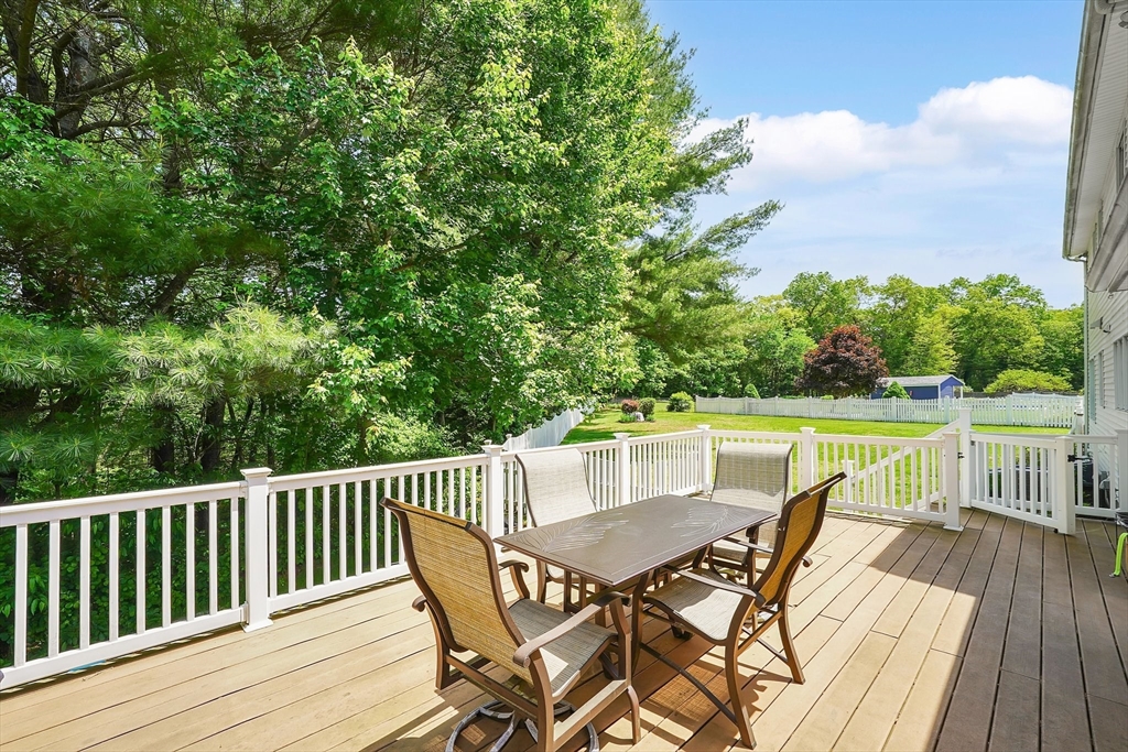 5 Evergreen Circle Wilbraham, MA 01095 - Photo 5 of 39 a view of a dining table and chairs on the roof deck