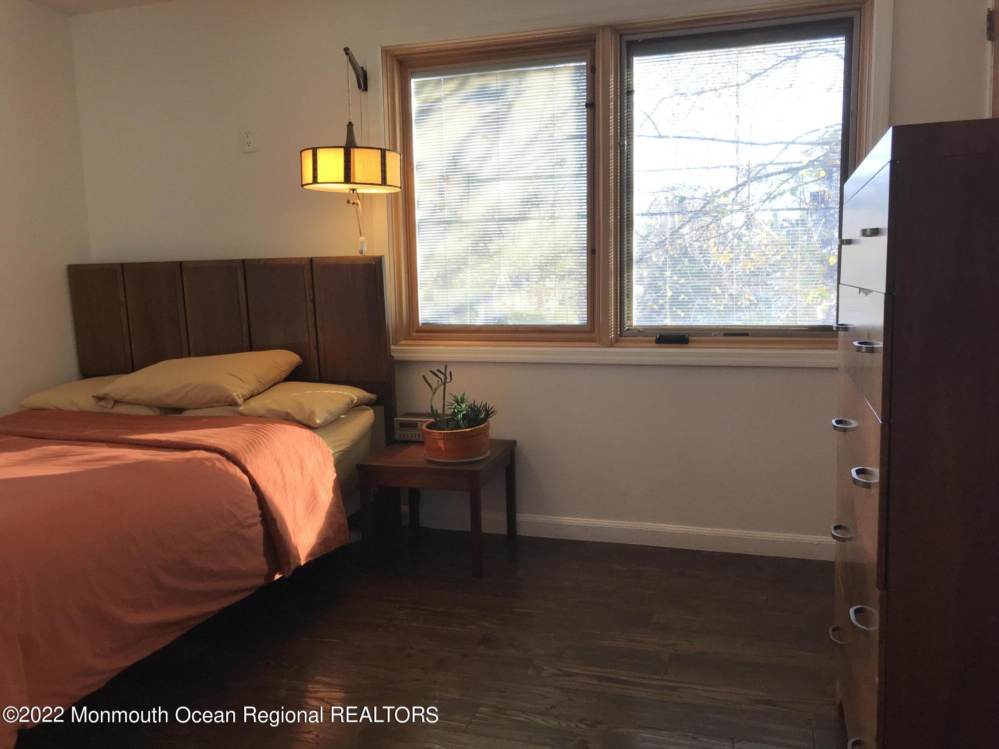 1715 J Street West Belmar, NJ 07719 - Photo 12 of 17 a bedroom with a bed and a window