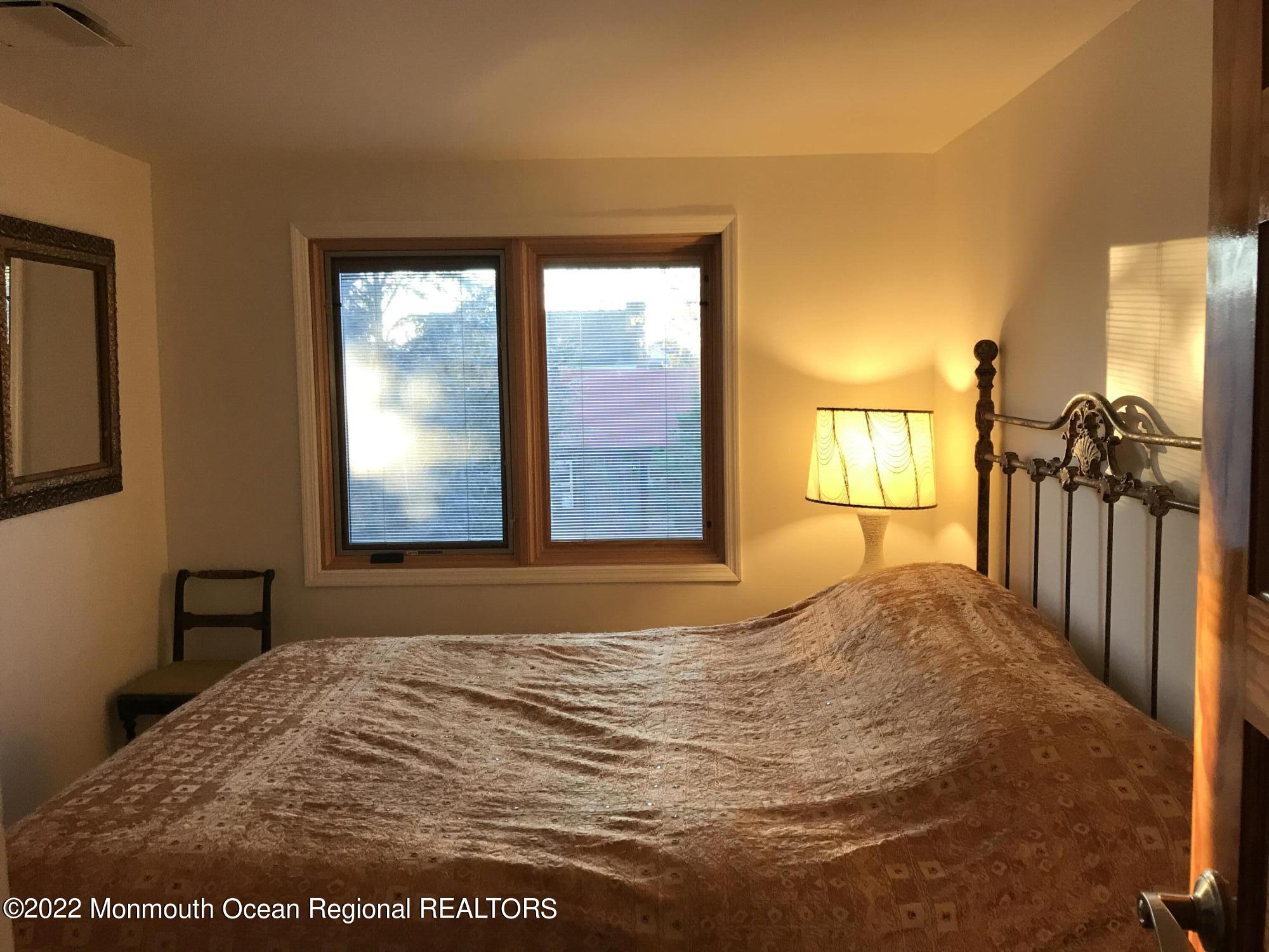 1715 J Street West Belmar, NJ 07719 - Photo 14 of 17 a bedroom with a bed and a window