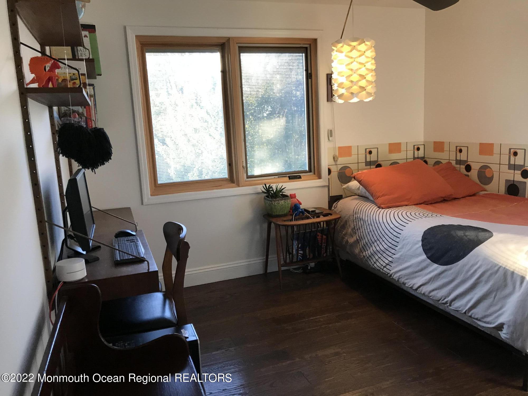 1715 J Street West Belmar, NJ 07719 - Photo 4 of 17 a bedroom with furniture and a window