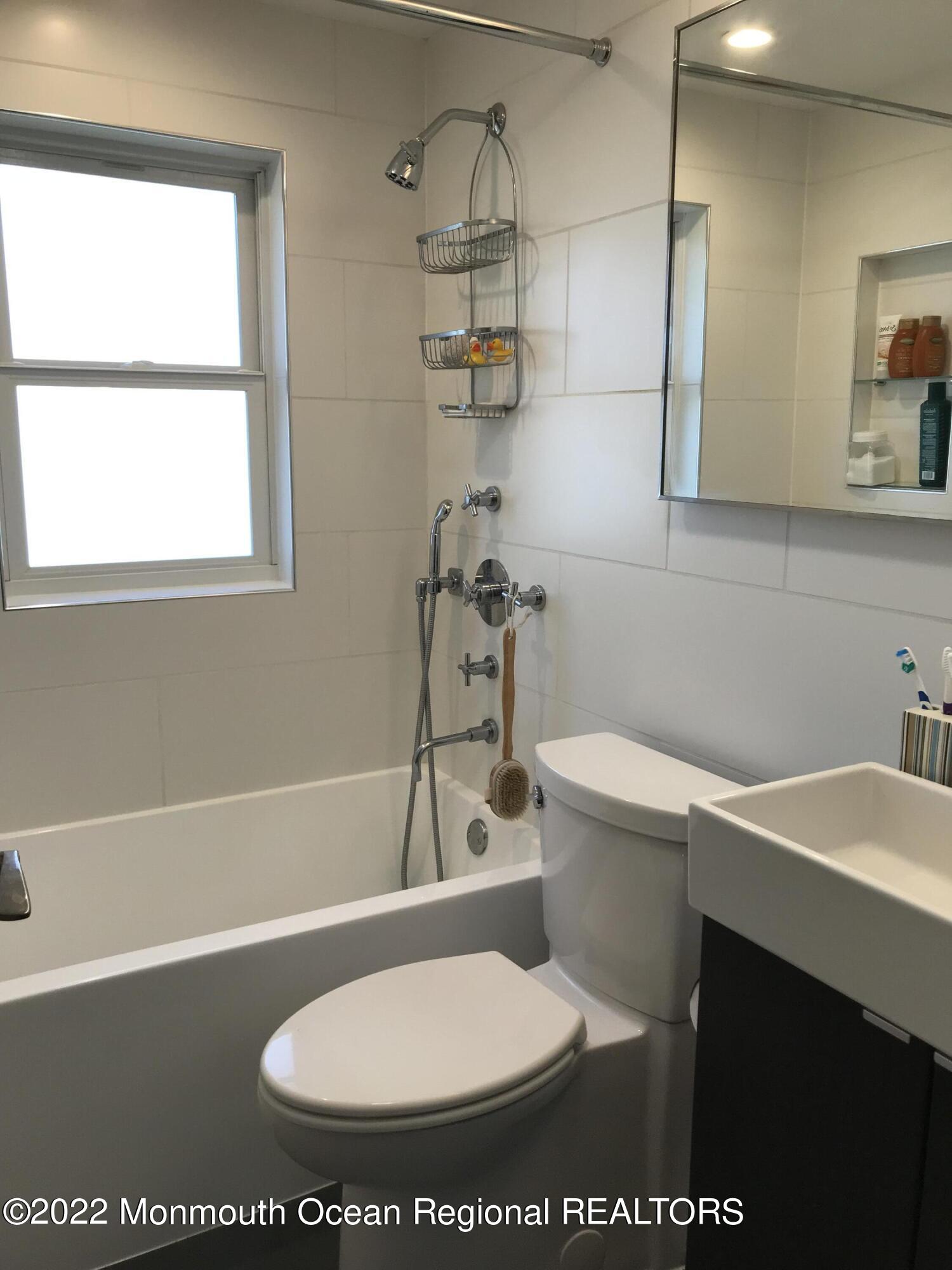 1715 J Street West Belmar, NJ 07719 - Photo 6 of 17 a bathroom with a sink a toilet and a bathtub