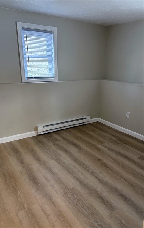2 Tideview Path, Unit 8 Plymouth, MA 02360 - Photo 12 of 16 a view of a room with wooden floor and windows