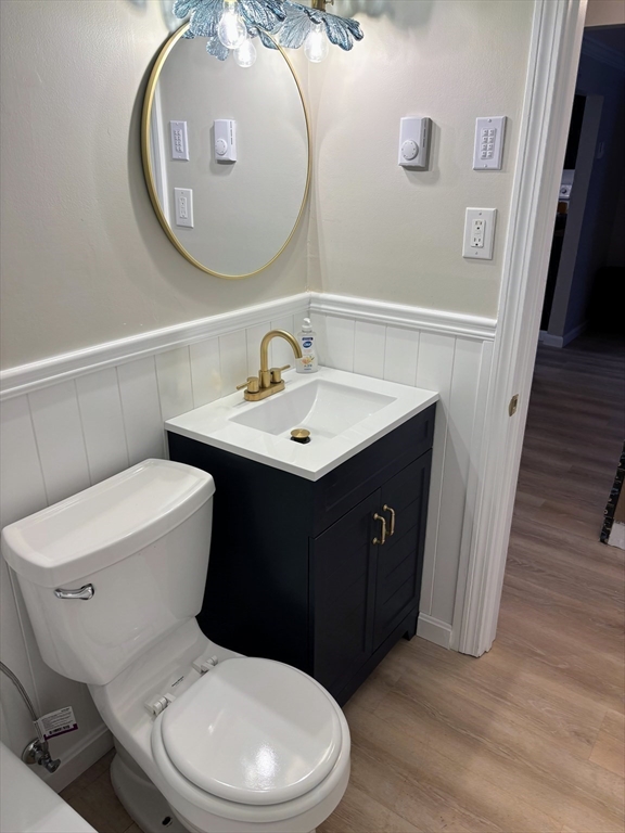 2 Tideview Path, Unit 8 Plymouth, MA 02360 - Photo 15 of 16 a bathroom with a toilet a sink and a mirror