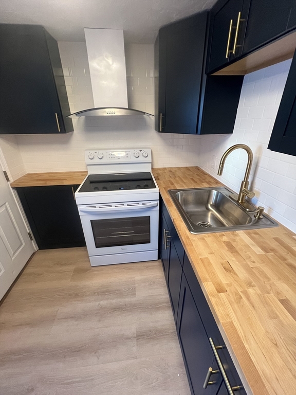 2 Tideview Path, Unit 8 Plymouth, MA 02360 - Photo 2 of 16 a kitchen with stainless steel appliances granite countertop a stove and a sink