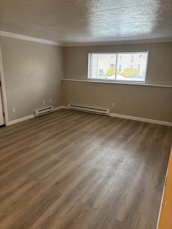 2 Tideview Path, Unit 8 Plymouth, MA 02360 - Photo 8 of 16 an empty room with wooden floor and a window