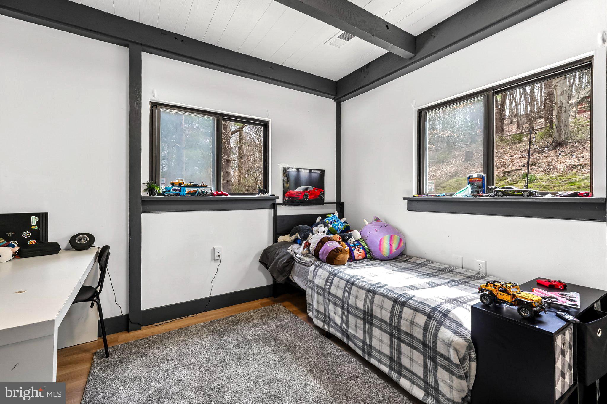 928 Stargazer Road Coatesville, PA 19320 - Photo 19 of 22 a bedroom with a bed and wooden floor