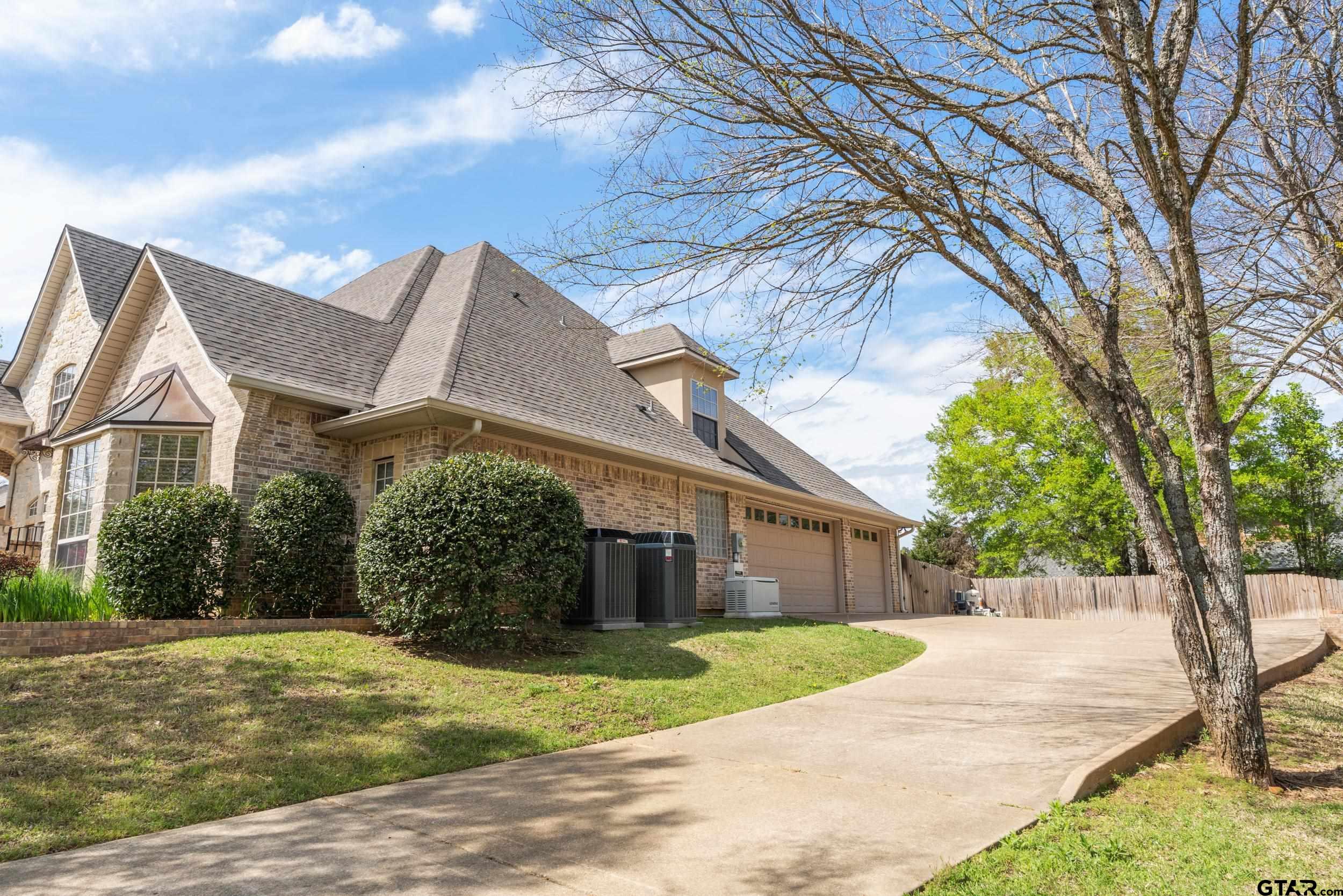 1509 Cooks Crossing Tyler, TX 75703 - Photo 2 of 48 a view of a house with a yard and large tree