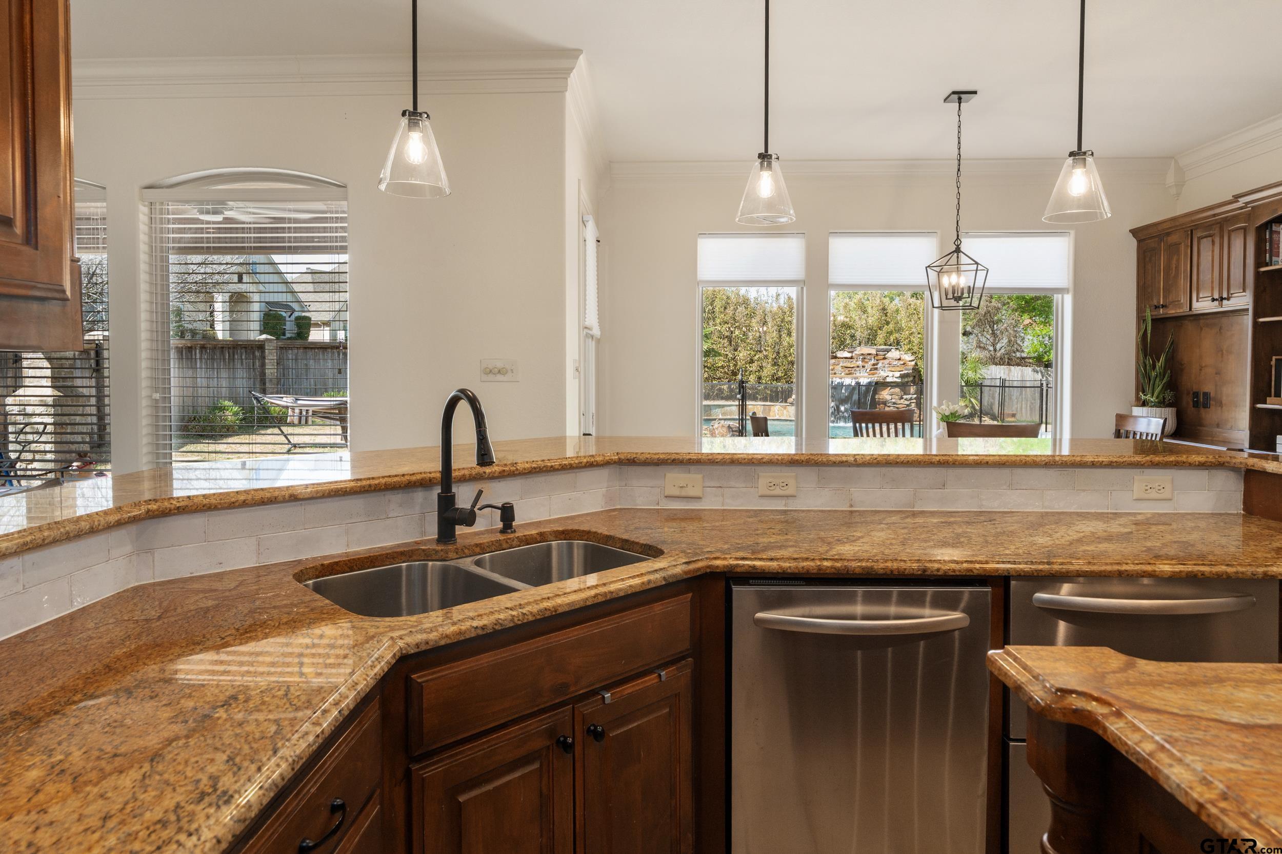 1509 Cooks Crossing Tyler, TX 75703 - Photo 23 of 48 a kitchen with granite countertop a sink and a window