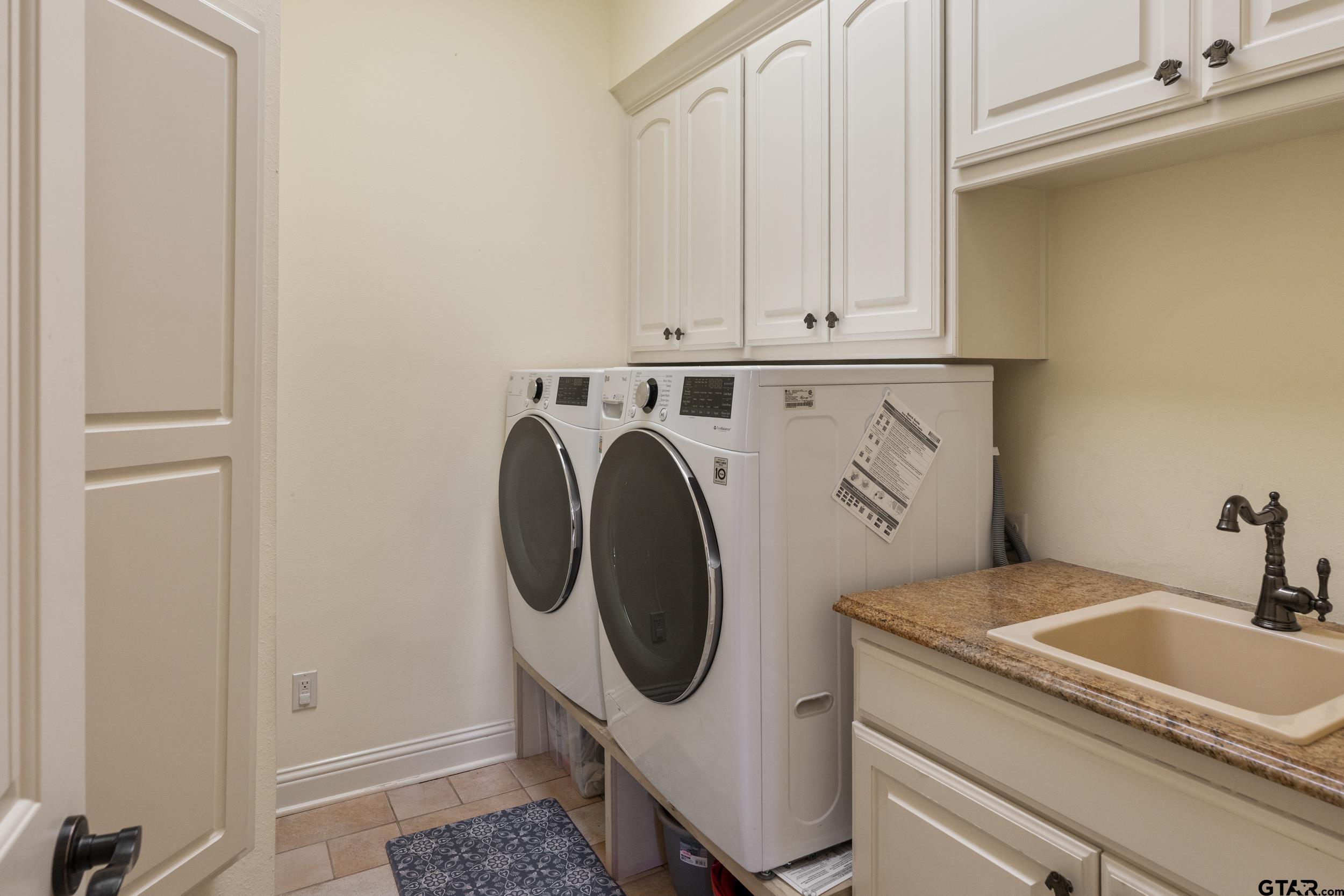 1509 Cooks Crossing Tyler, TX 75703 - Photo 24 of 48 a utility room with dryer and washer