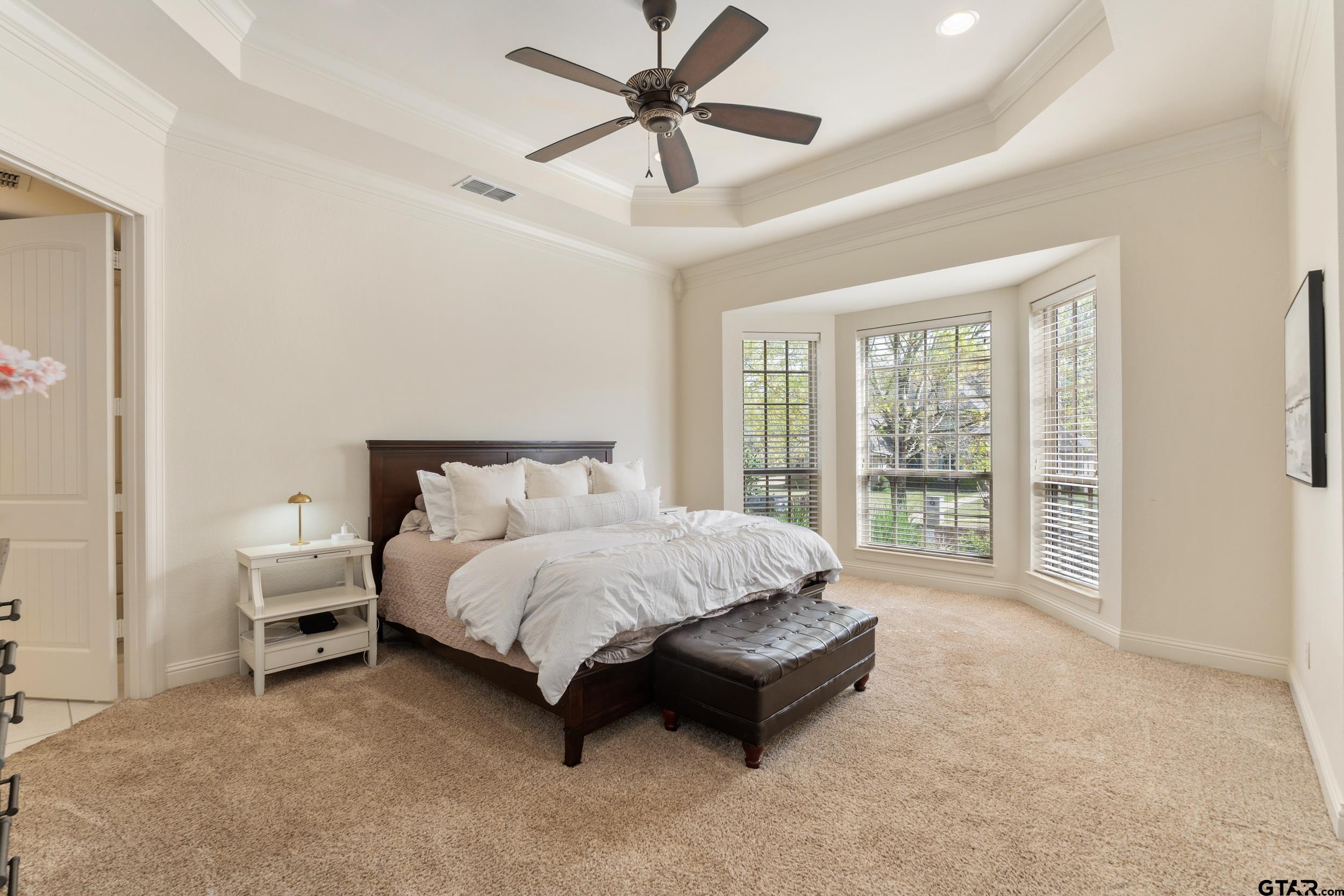 1509 Cooks Crossing Tyler, TX 75703 - Photo 27 of 48 a spacious bedroom with a bed and a large window