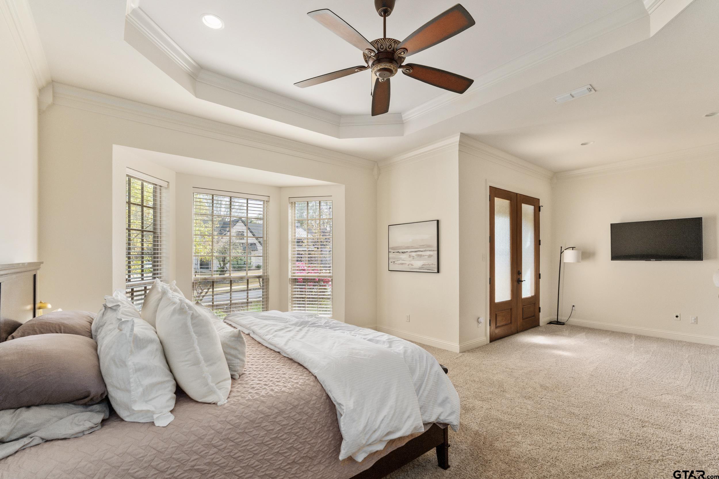 1509 Cooks Crossing Tyler, TX 75703 - Photo 28 of 48 a spacious bedroom with a bed and a large window