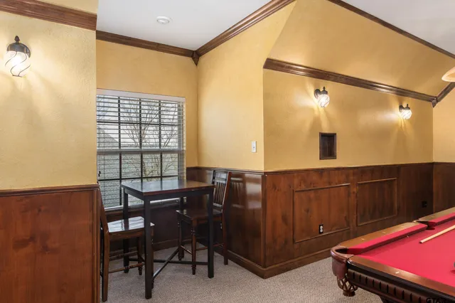 a view of a livingroom with furniture and a window