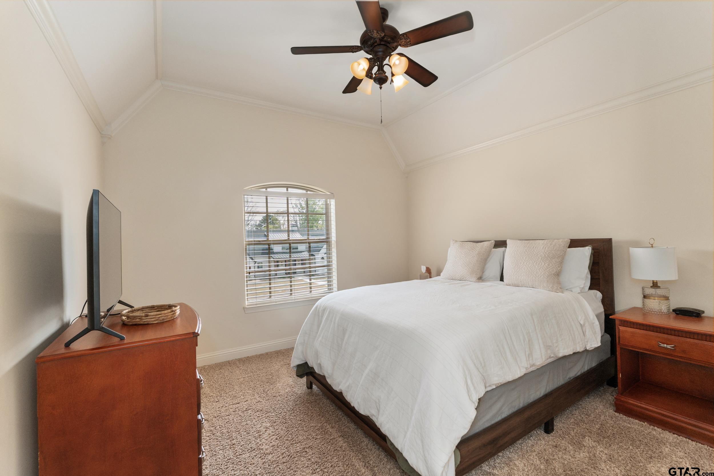 1509 Cooks Crossing Tyler, TX 75703 - Photo 39 of 48 a bedroom with a bed and a flat screen tv