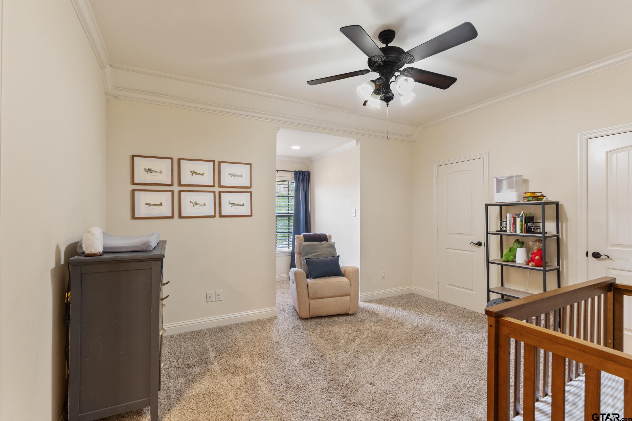 1509 Cooks Crossing Tyler, TX 75703 - Photo 41 of 48 a living room with lots of furniture and baby bed