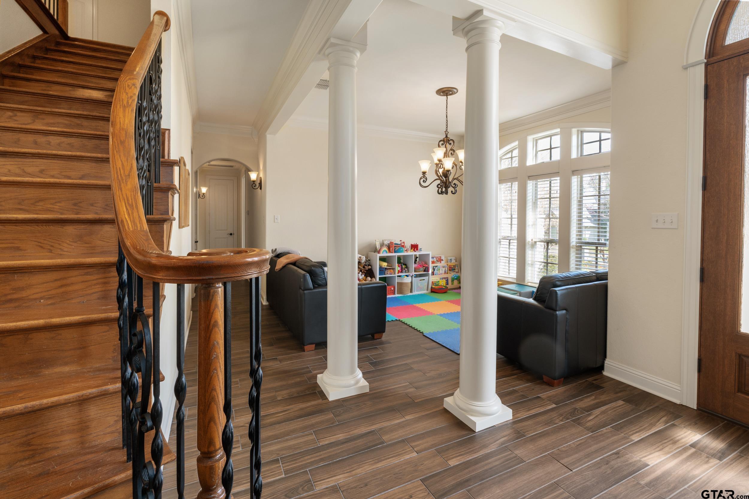 1509 Cooks Crossing Tyler, TX 75703 - Photo 6 of 48 a view of a hallway with wooden floor and staircase