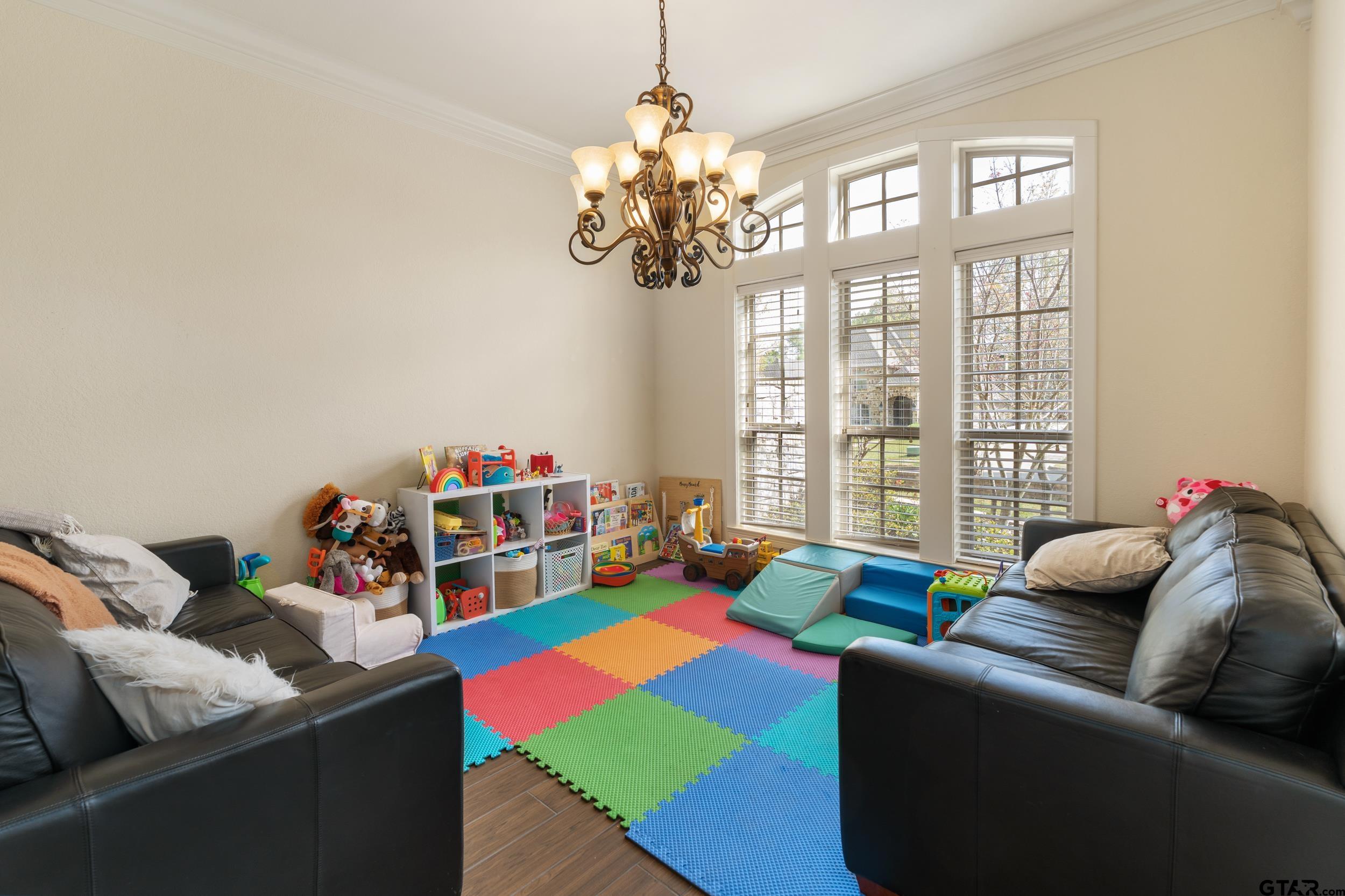 1509 Cooks Crossing Tyler, TX 75703 - Photo 7 of 48 a living room with furniture and a chandelier