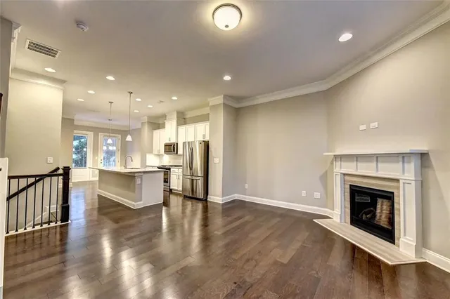 an open space with kitchen view and a fireplace