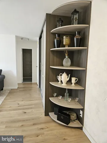 a room with shelf with wine and racks