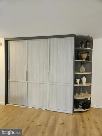 a view of an empty room with empty shelves