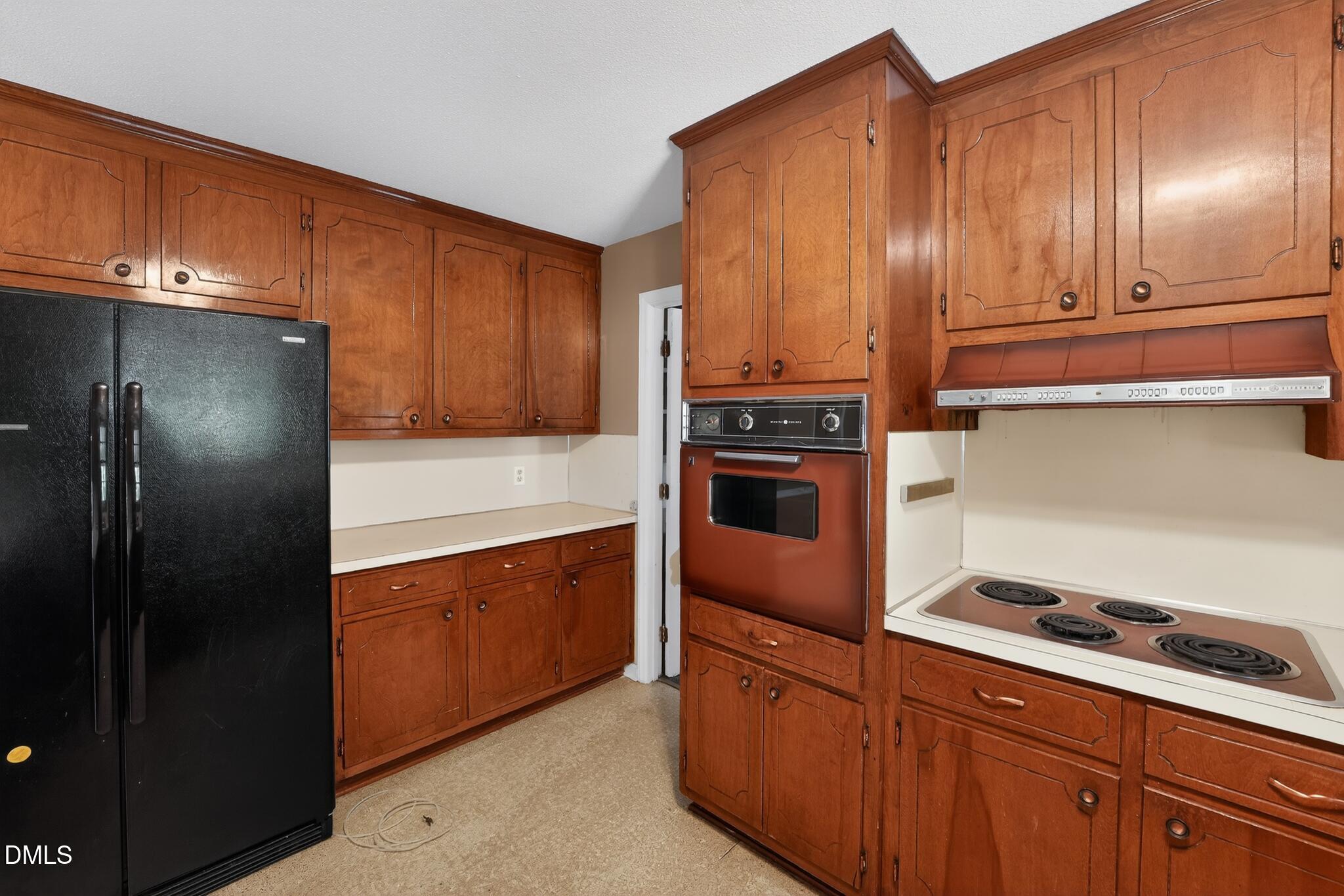 1034 Jerome Road Durham, NC 27713 - Photo 17 of 35 a kitchen with stainless steel appliances granite countertop a refrigerator and a stove top oven