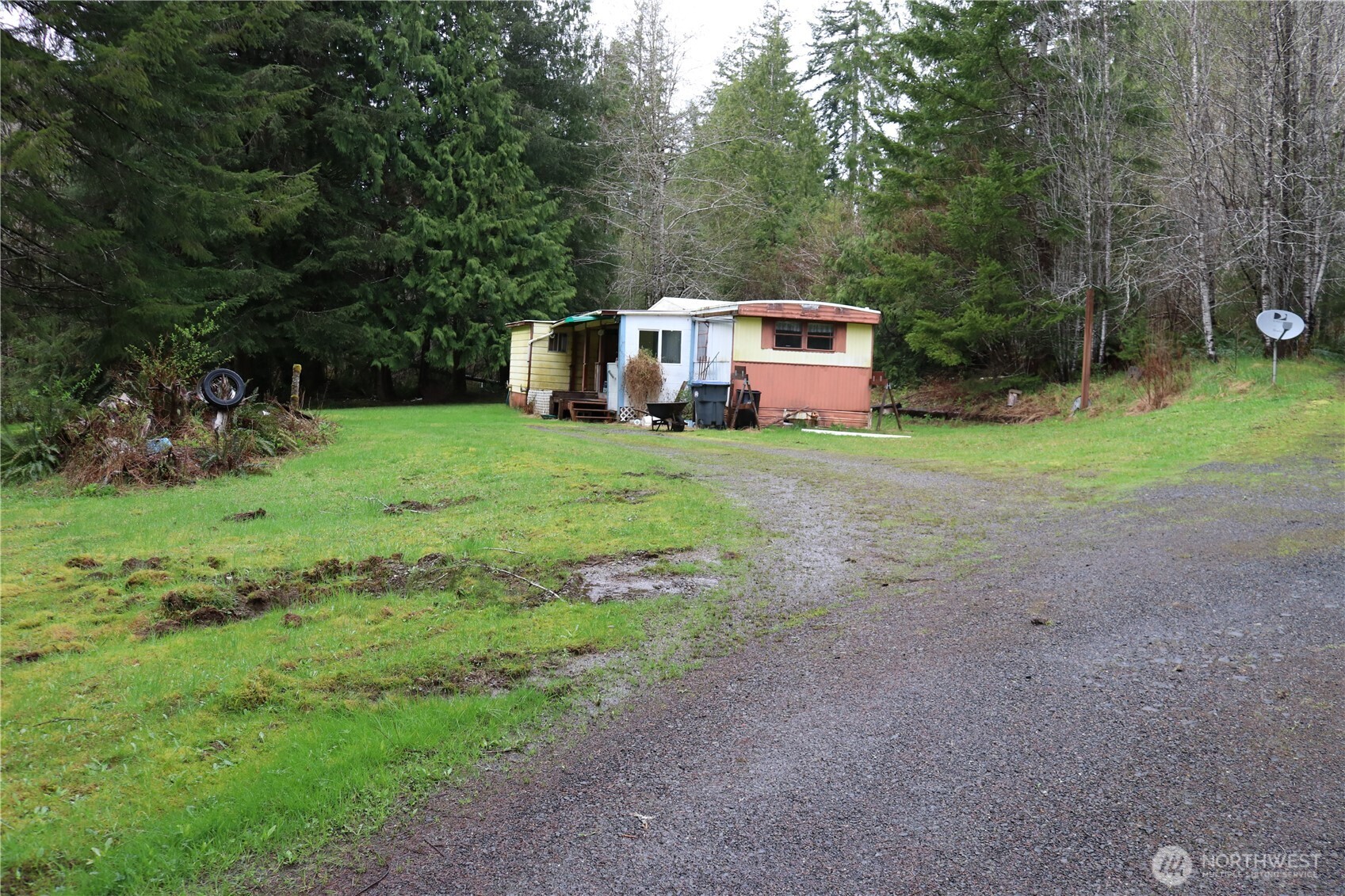 309 Powers Creek Road Elma, WA 98541 - Photo 3 of 21 a house with green field in front of it