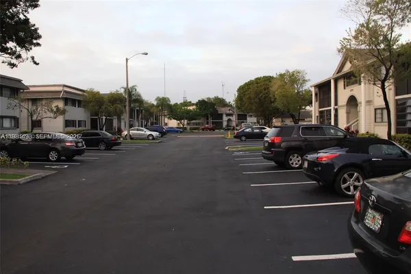 a view of street with parked cars