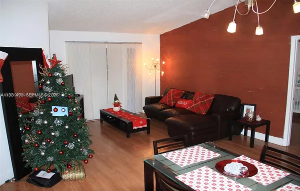 a bedroom with furniture and a potted plant