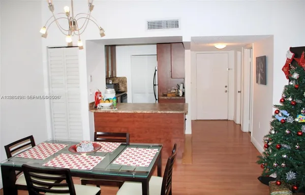 a dining room with table and chairs