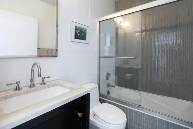 a bedroom with bed and a window