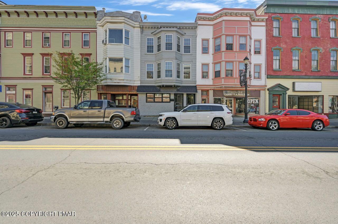 a cars parked in front of a building