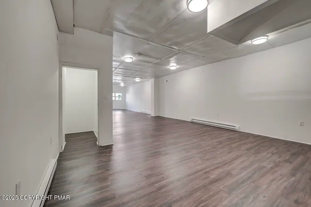 a view of a room that has a window in it