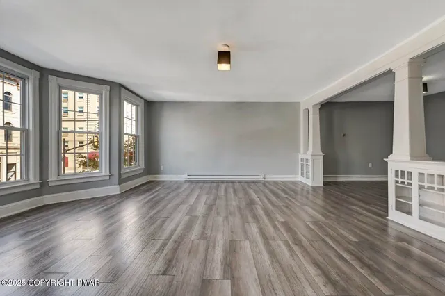 a view of a building with car parked