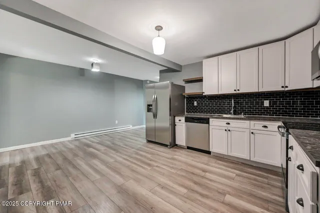 a lake view with a bench next to a lake