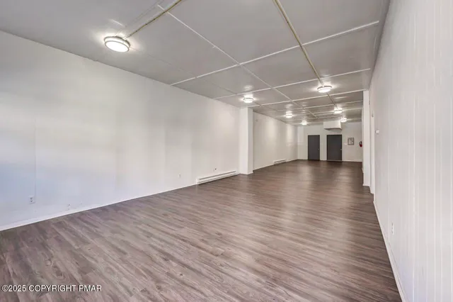 a kitchen with stainless steel appliances a refrigerator and a stove top oven