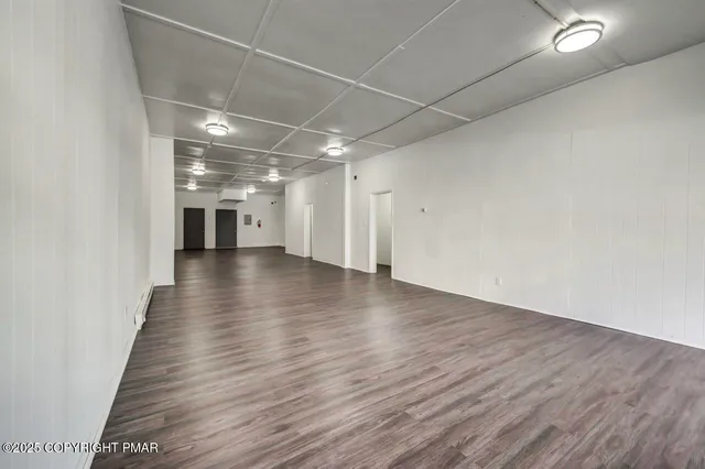 a kitchen with granite countertop a stove and a sink