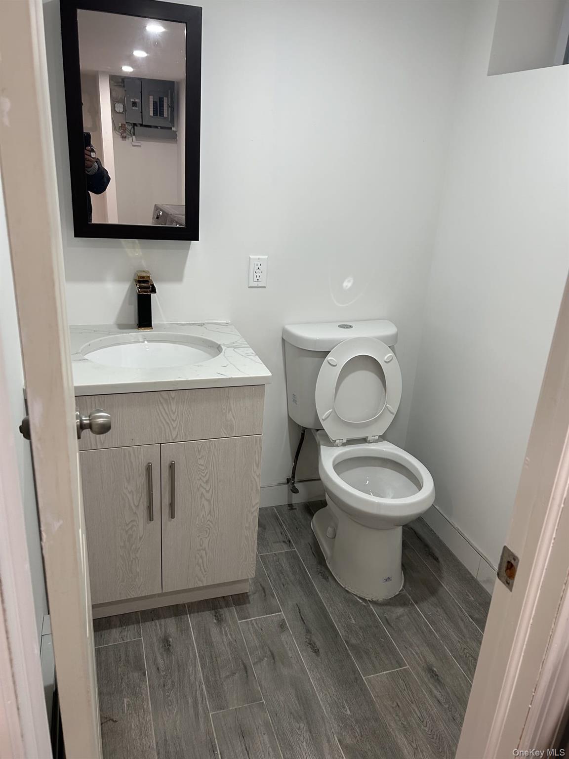 91-08 77th Street Queens, NY 11421 - Photo 16 of 20 Half bathroom in basement