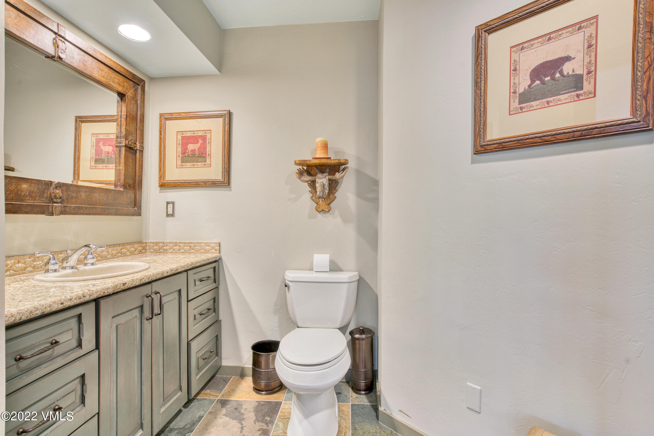 770 Potato Patch Drive, Unit 6 Vail, CO 81657 - Photo 12 of 28 a bathroom with a toilet a sink and mirror
