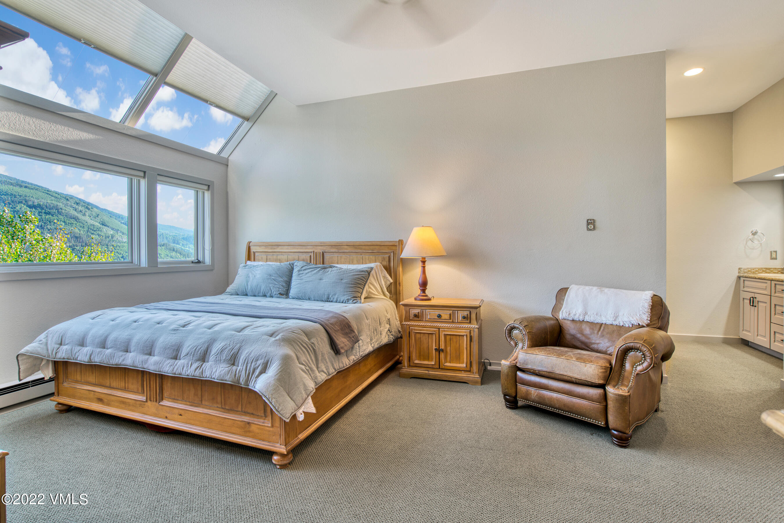 770 Potato Patch Drive, Unit 6 Vail, CO 81657 - Photo 14 of 28 a bedroom with a bed and a couch