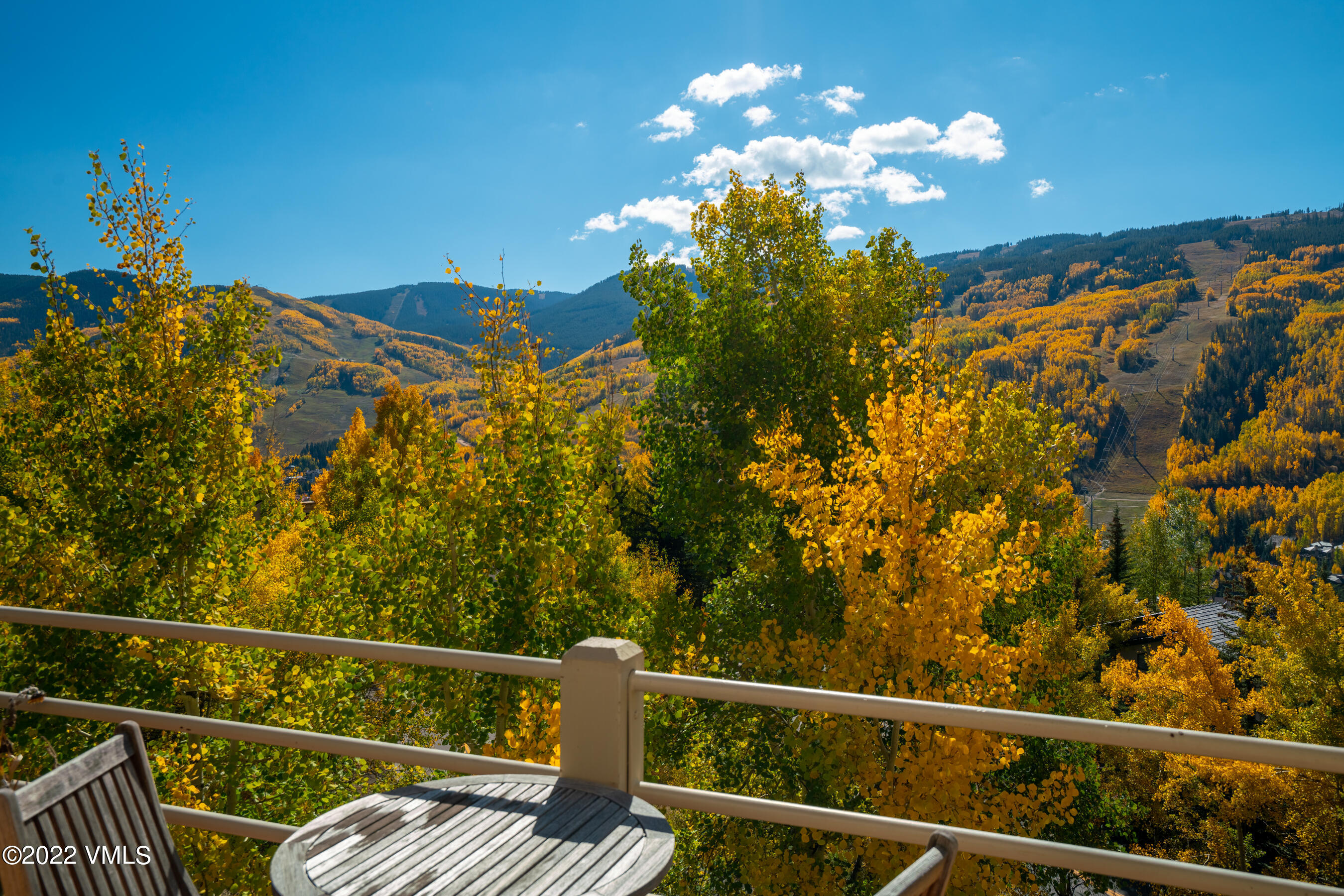 770 Potato Patch Drive, Unit 6 Vail, CO 81657 - Photo 26 of 28 a view of a balcony with wooden stairs