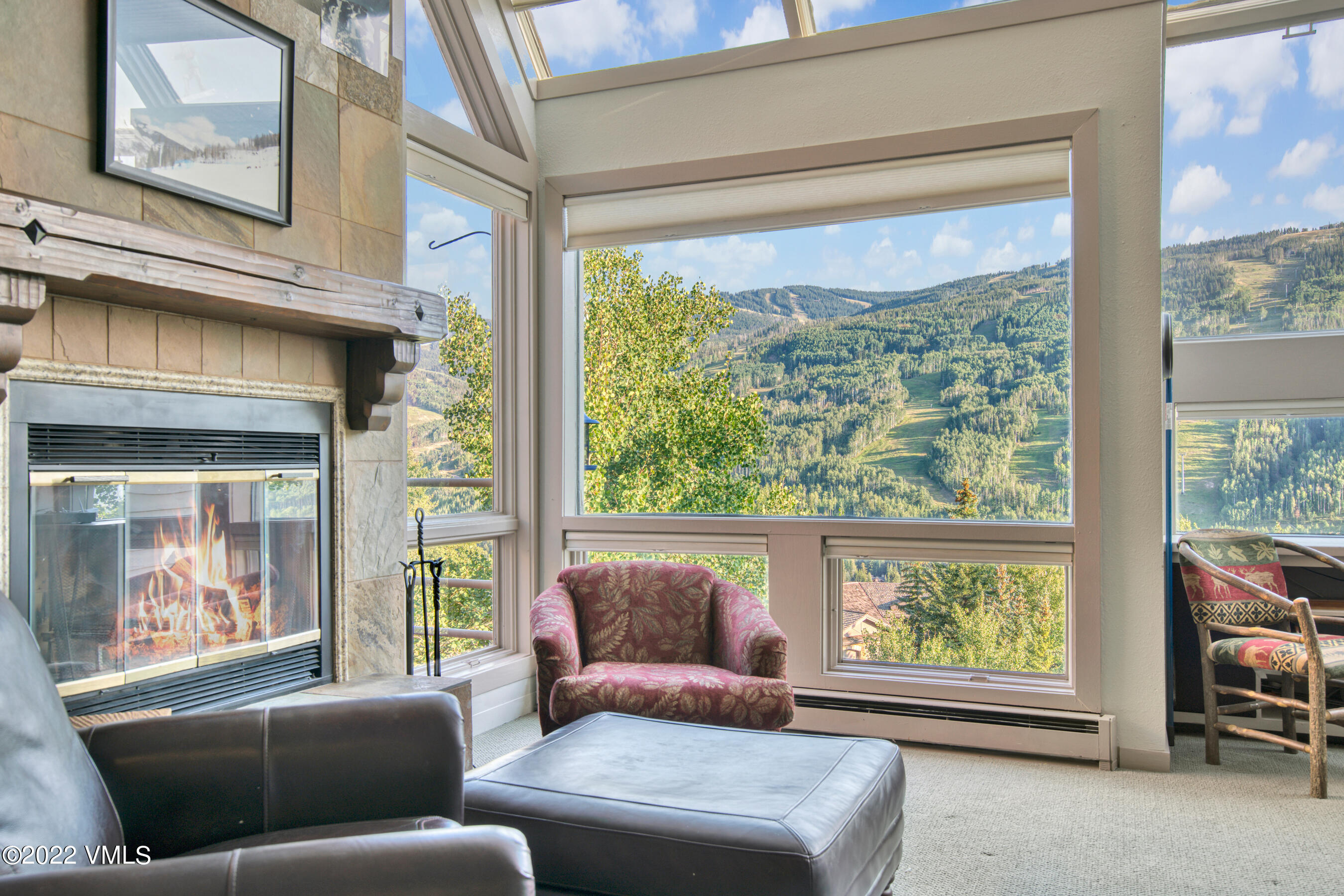 770 Potato Patch Drive, Unit 6 Vail, CO 81657 - Photo 8 of 28 a living room with furniture and a large window