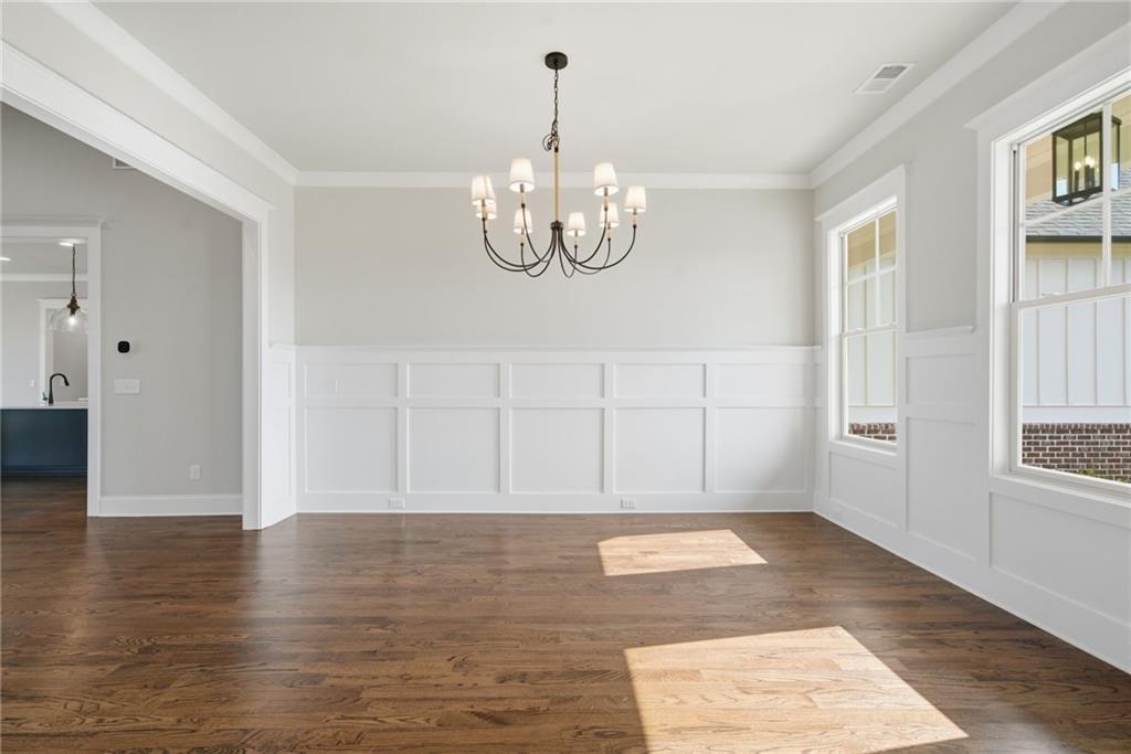 5364 Price Road Gainesville, GA 30506 - Photo 10 of 59 a view of an empty room with wooden floor and windows