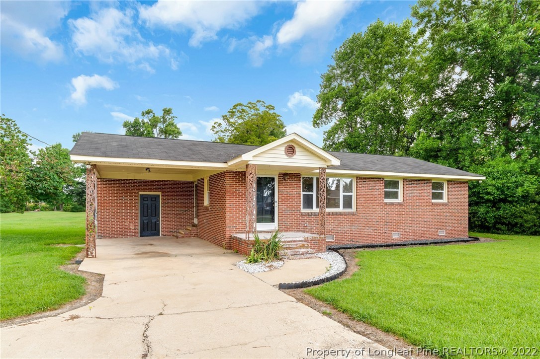77 Hiawatha Road Pembroke, NC 28372 - Photo 1 of 30 a front view of a house with garden