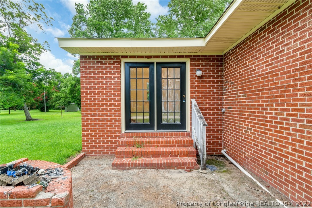 77 Hiawatha Road Pembroke, NC 28372 - Photo 26 of 30 a front view of a house with a garden