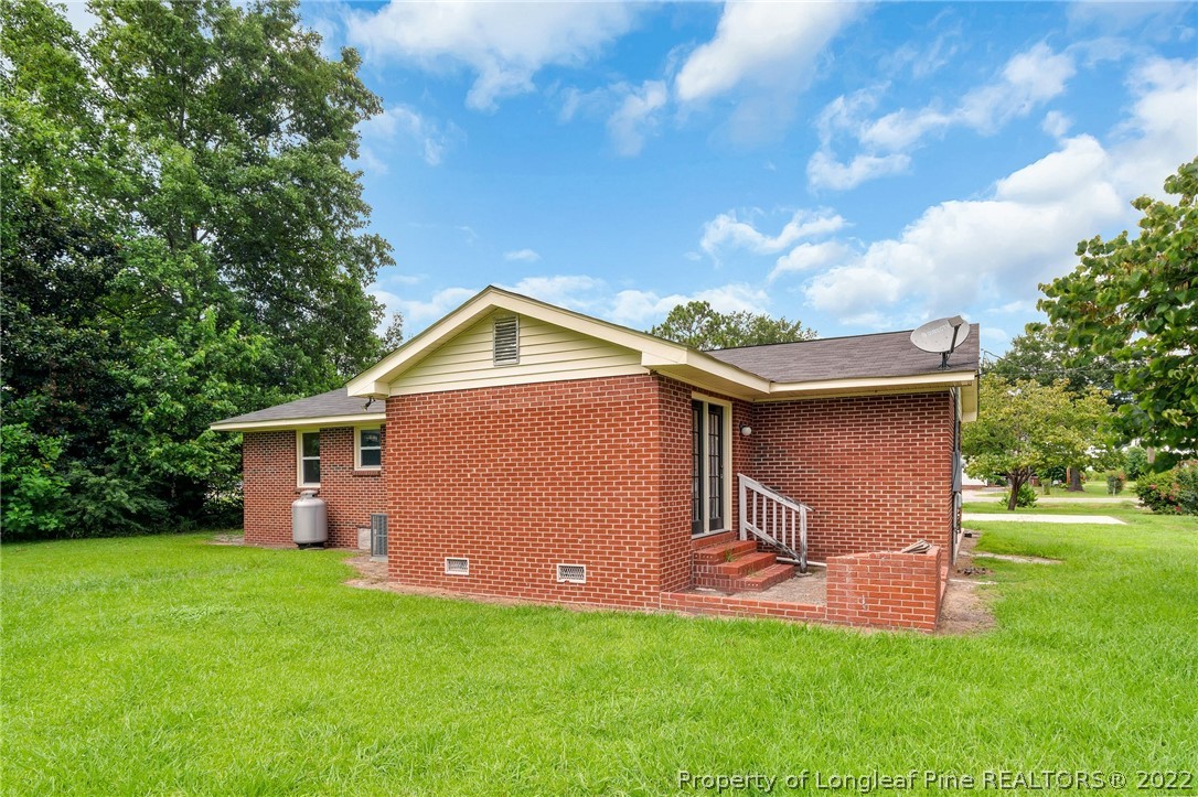 77 Hiawatha Road Pembroke, NC 28372 - Photo 27 of 30 a front view of house with backyard and green space