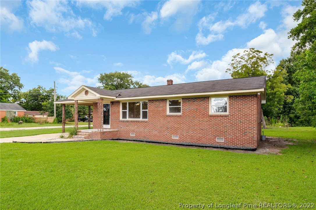 77 Hiawatha Road Pembroke, NC 28372 - Photo 3 of 30 a front view of house with a garden