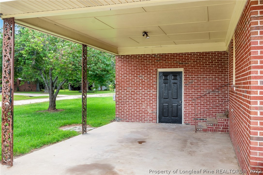77 Hiawatha Road Pembroke, NC 28372 - Photo 4 of 30 a front view of a house with garden