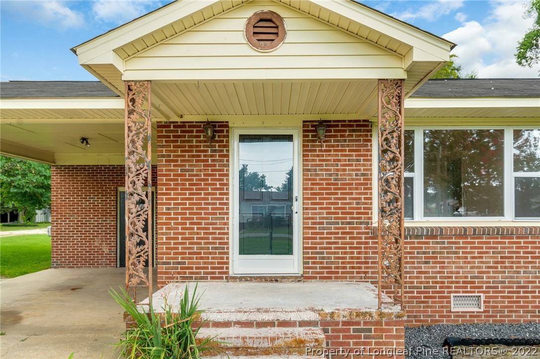 77 Hiawatha Road Pembroke, NC 28372 - Photo 5 of 30 a front view of a house with a garage