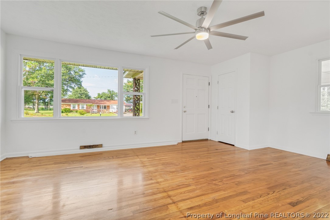 77 Hiawatha Road Pembroke, NC 28372 - Photo 7 of 30 a view of an empty room with a window and a ceiling fan